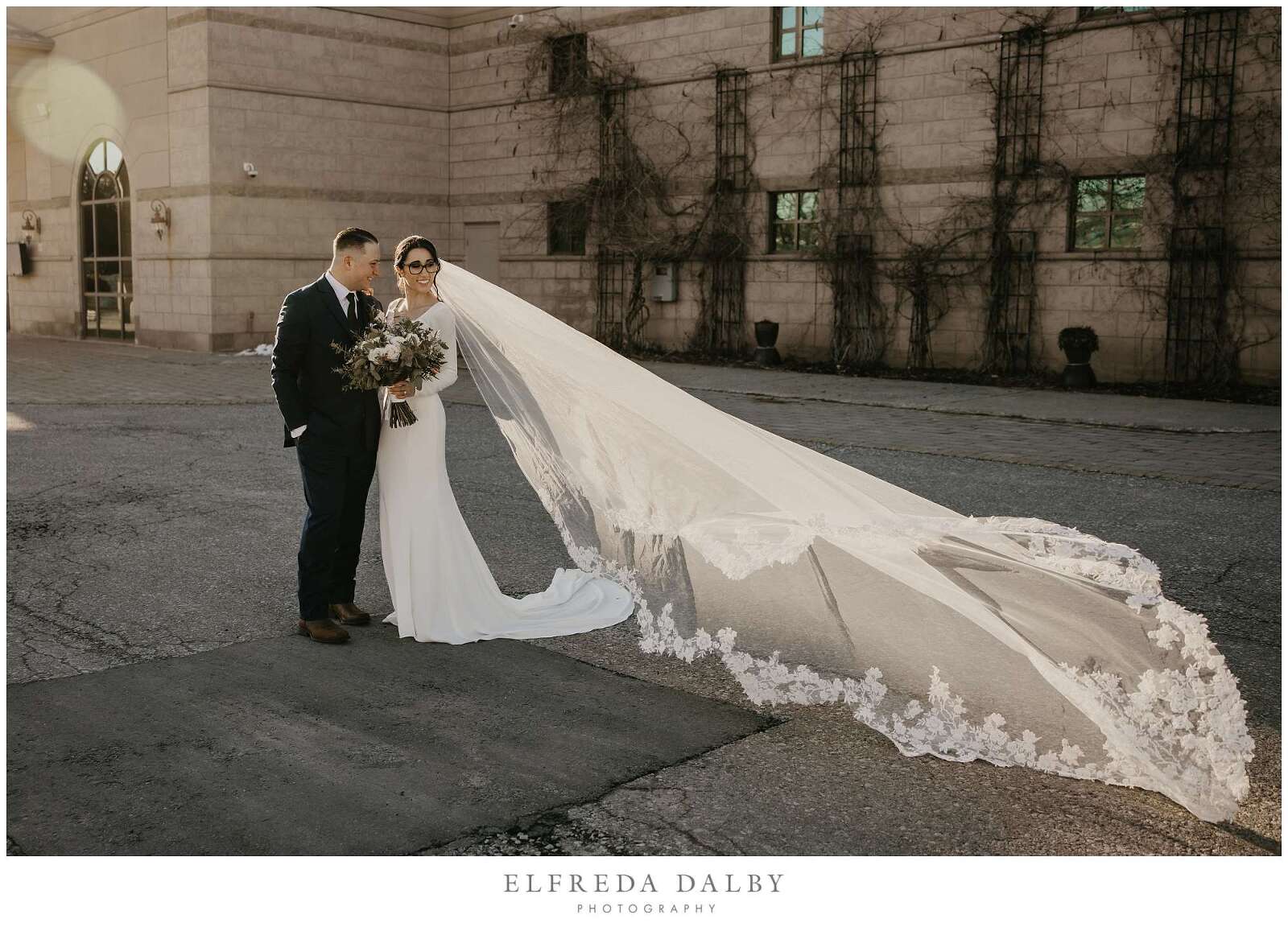 Bride and groom in front of the Royal Ambassador Banquet