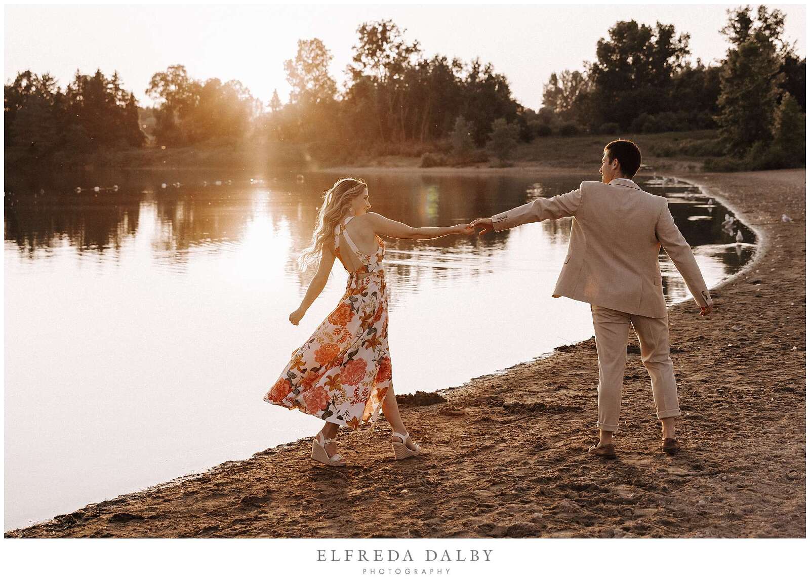 Couple waling on the beach with beautiful golden light