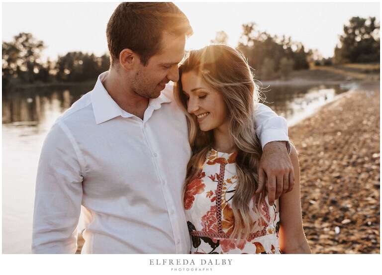 Couple walking on the beach during sunset