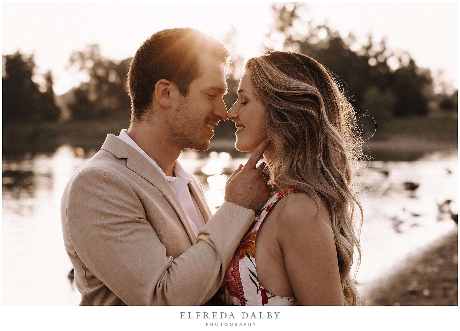 Gorgeous engaged couple during sunset