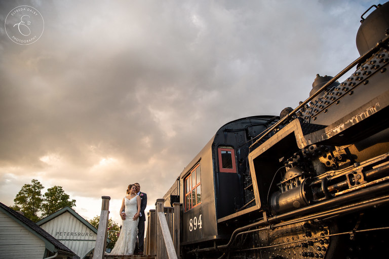 Sunset wedding couple next to train