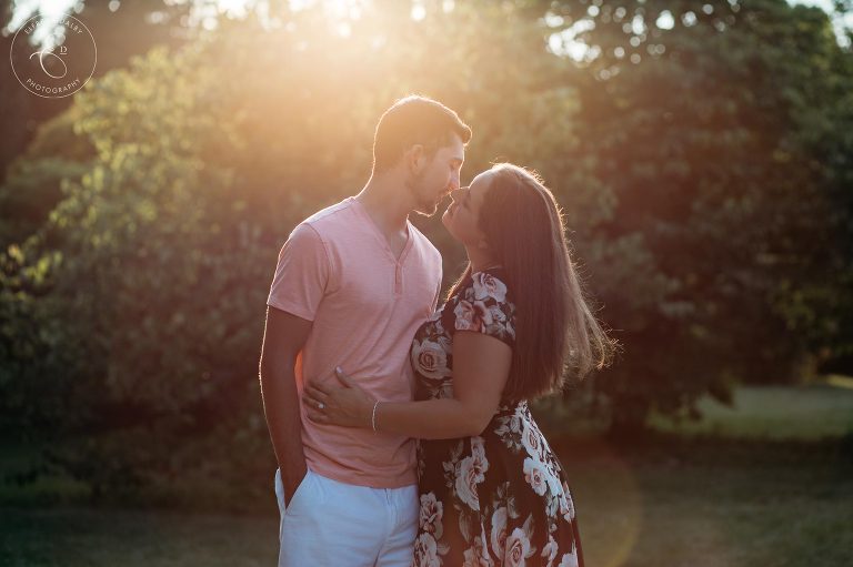 Couple go for a kiss during golden light