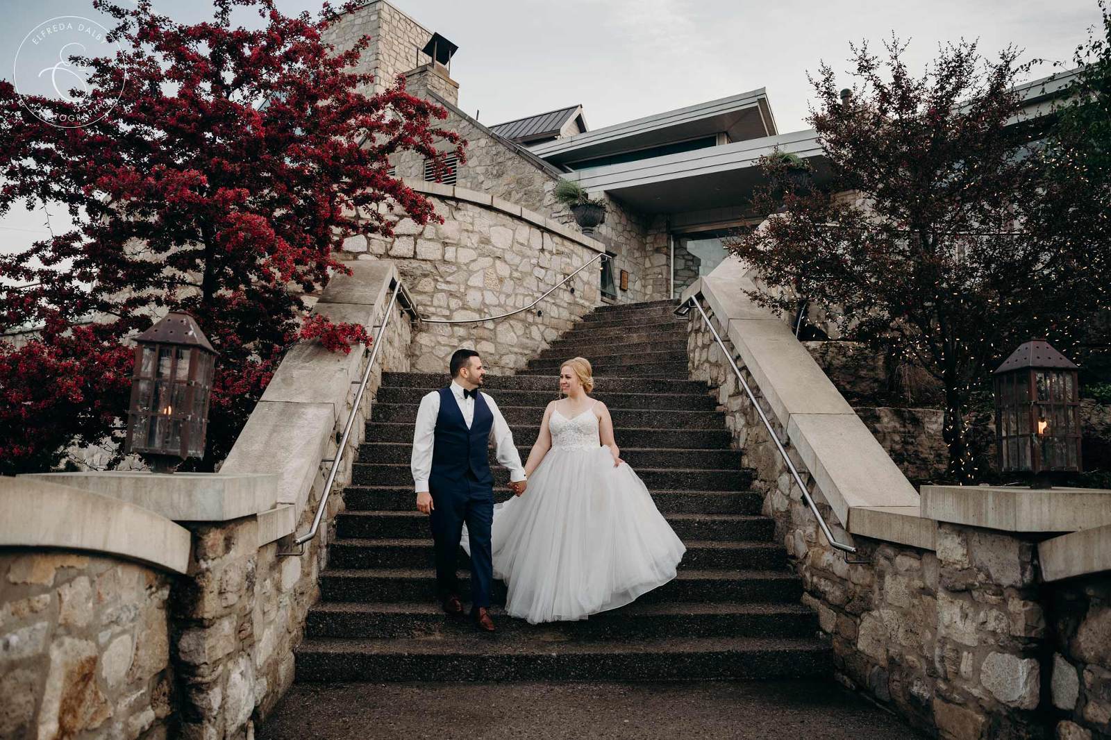 Wedding Couple on the stairs in front of Cambridge Mill
