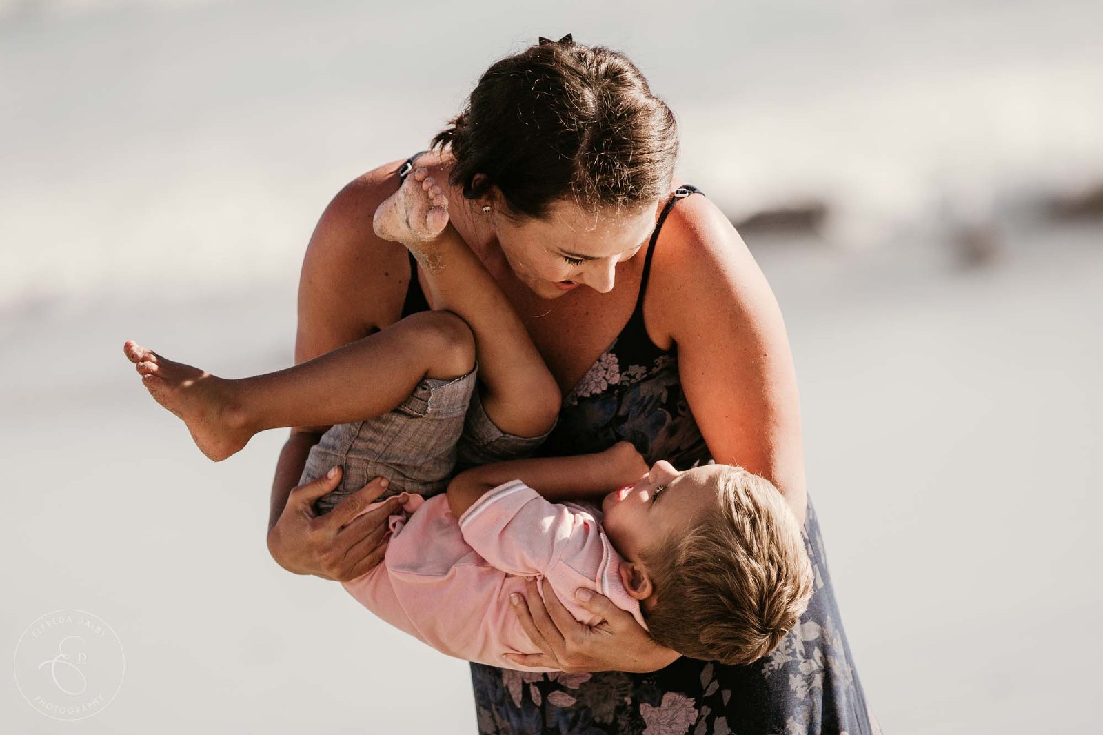 Mother holding her little boy in her arms