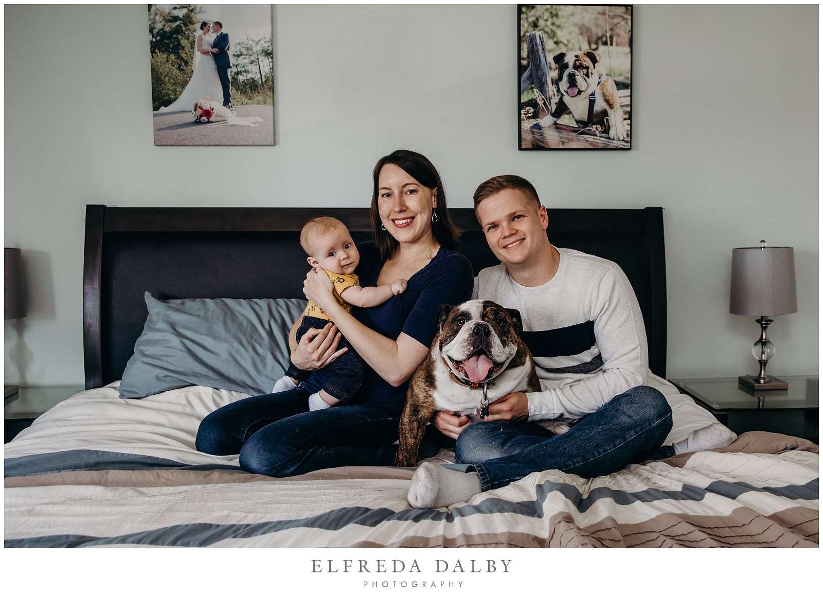 Family with a bulldog on the bed