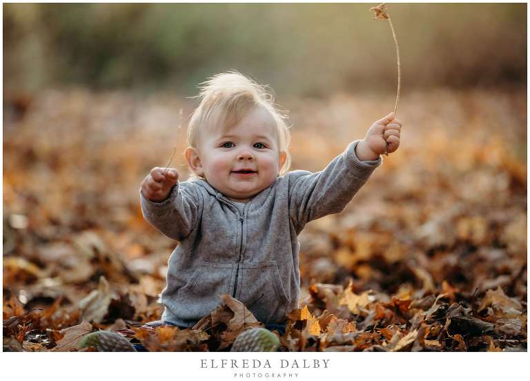 Adorable little boy holding a leave