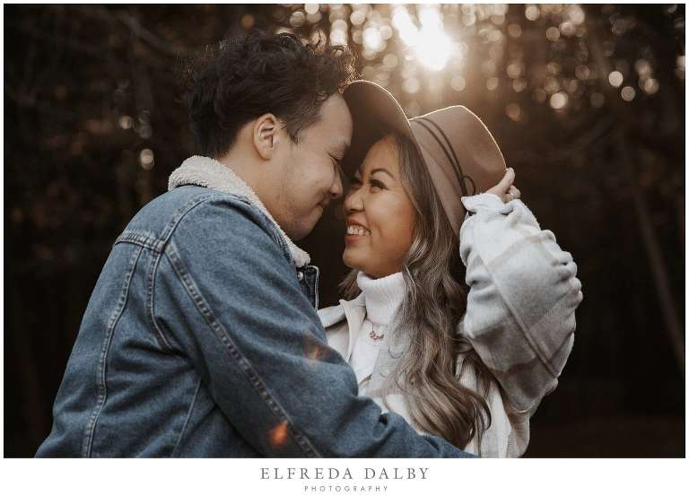 Cute couple during their engagement session in gorgeous golden light