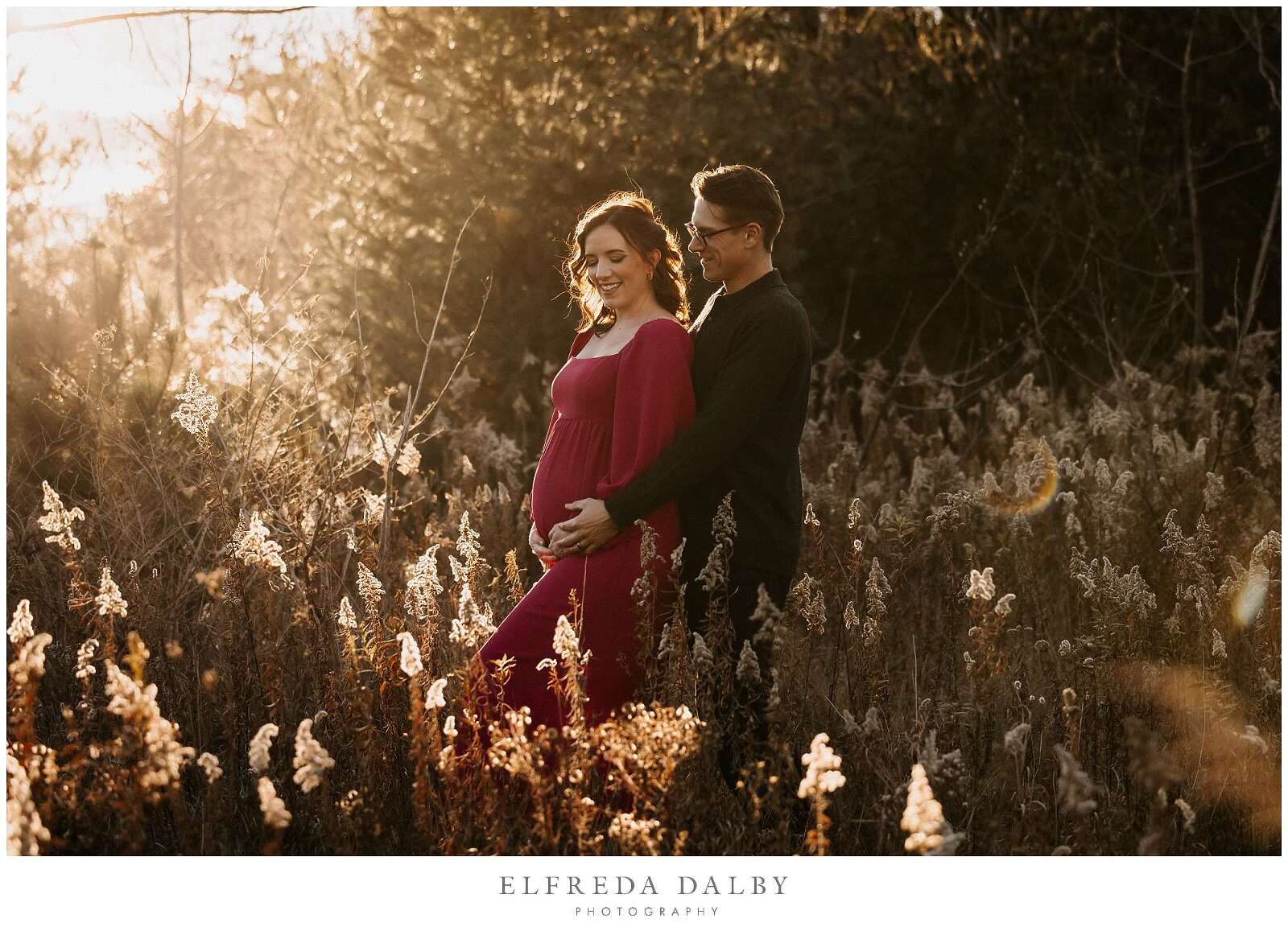 Pregnant woman with her husband during golden hour