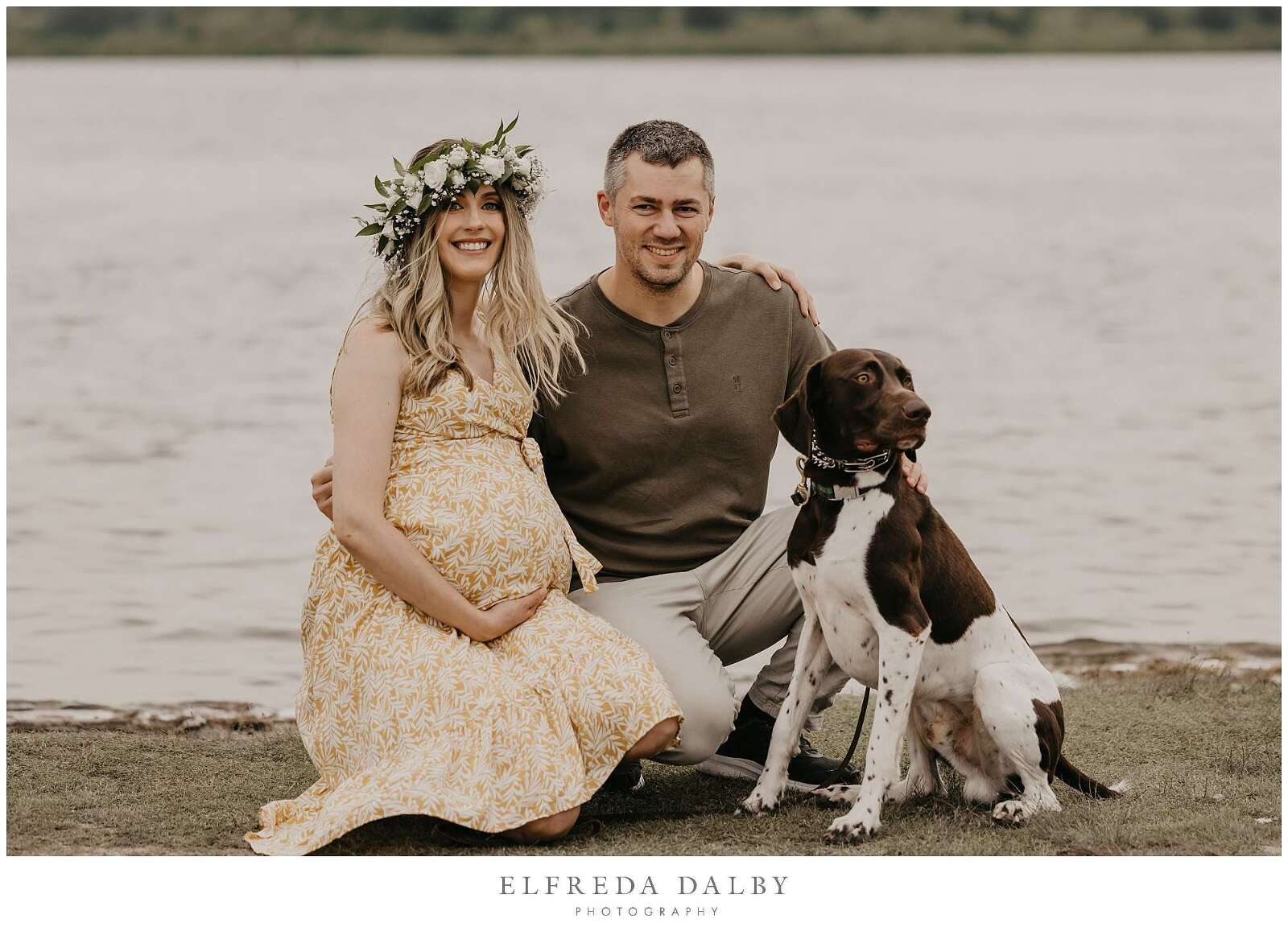 Pregnant woman with her husband and dog