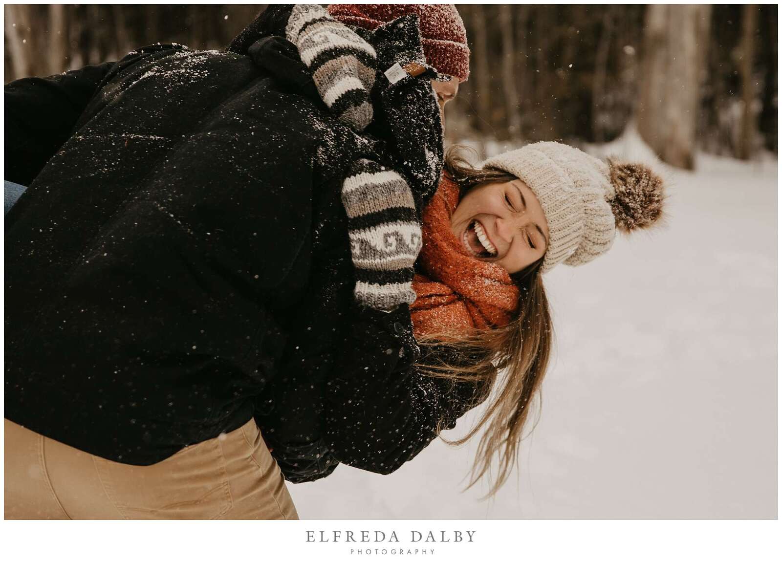 Playful couple in the snow