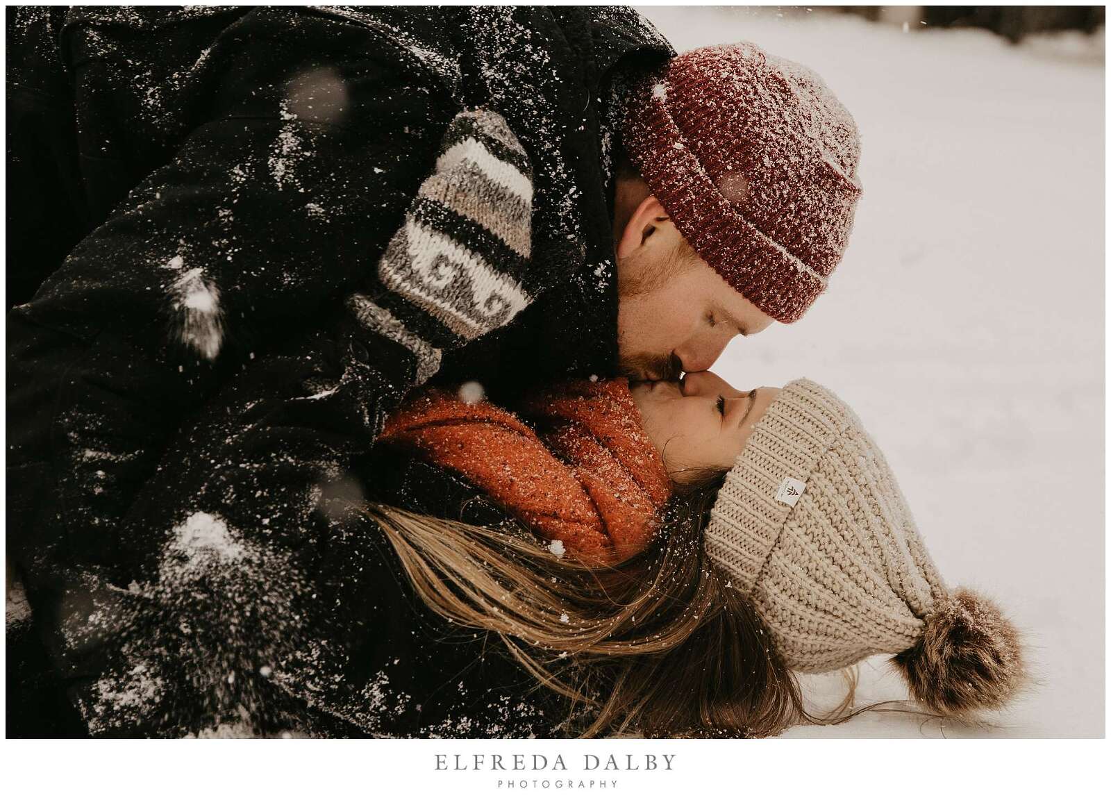 Couple kissing in the snow