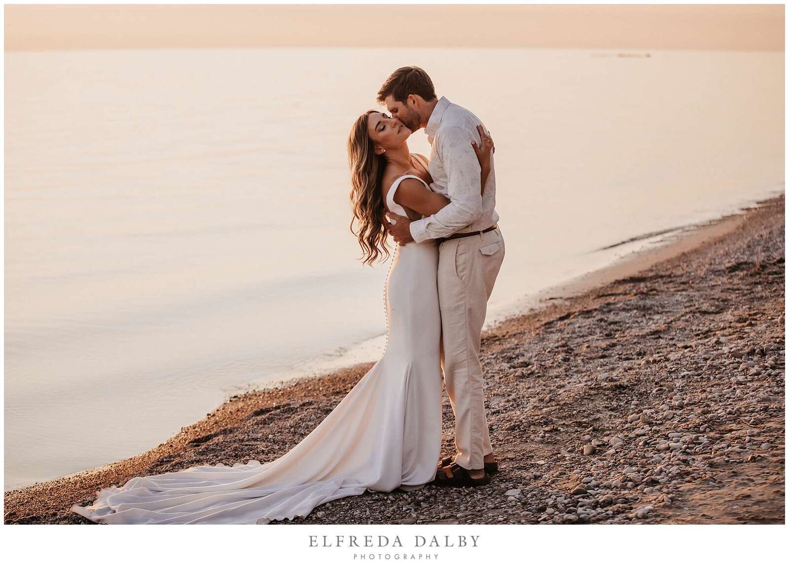 Romantic wedding couple on Kincardine beach at sunset