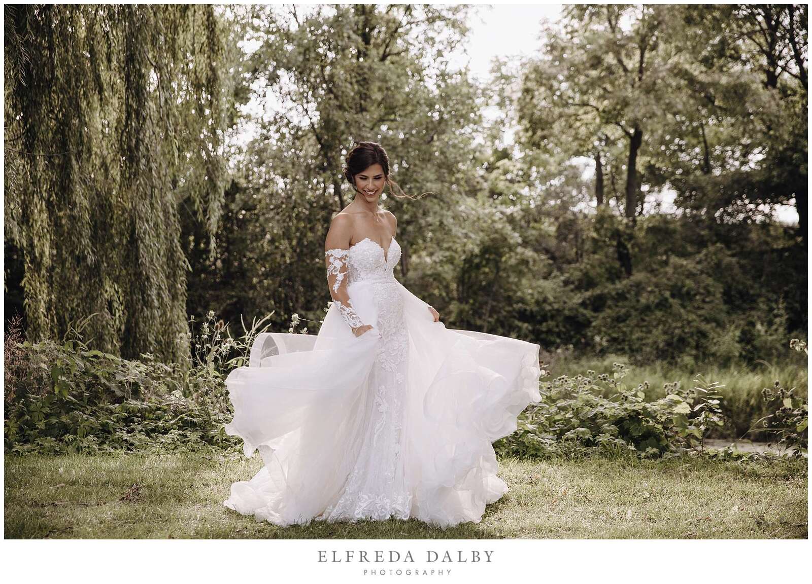 Bride admiring her wedding dress at Monthill golf club
