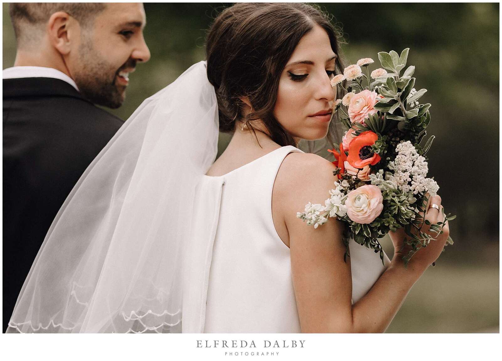 Bride smelling her flowers at Hockley Valley Resort