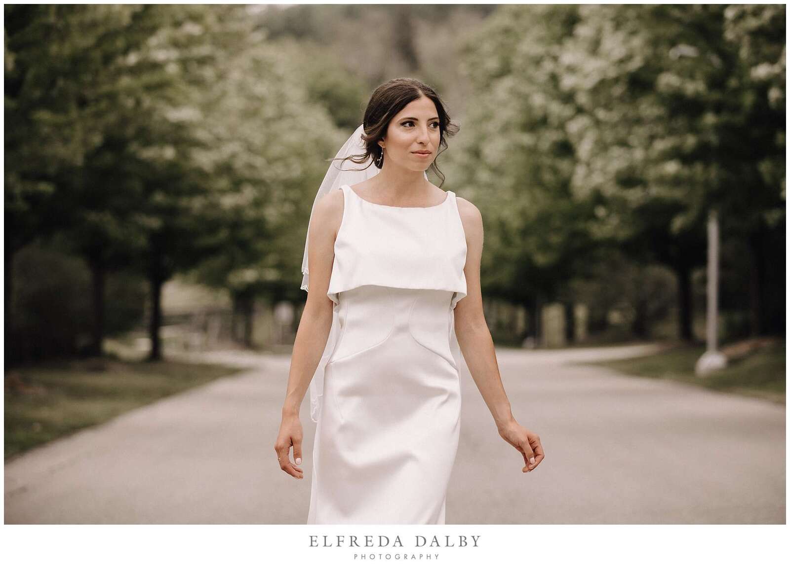 Bride walking in the road in front of Hockley Valley Resort in Mono