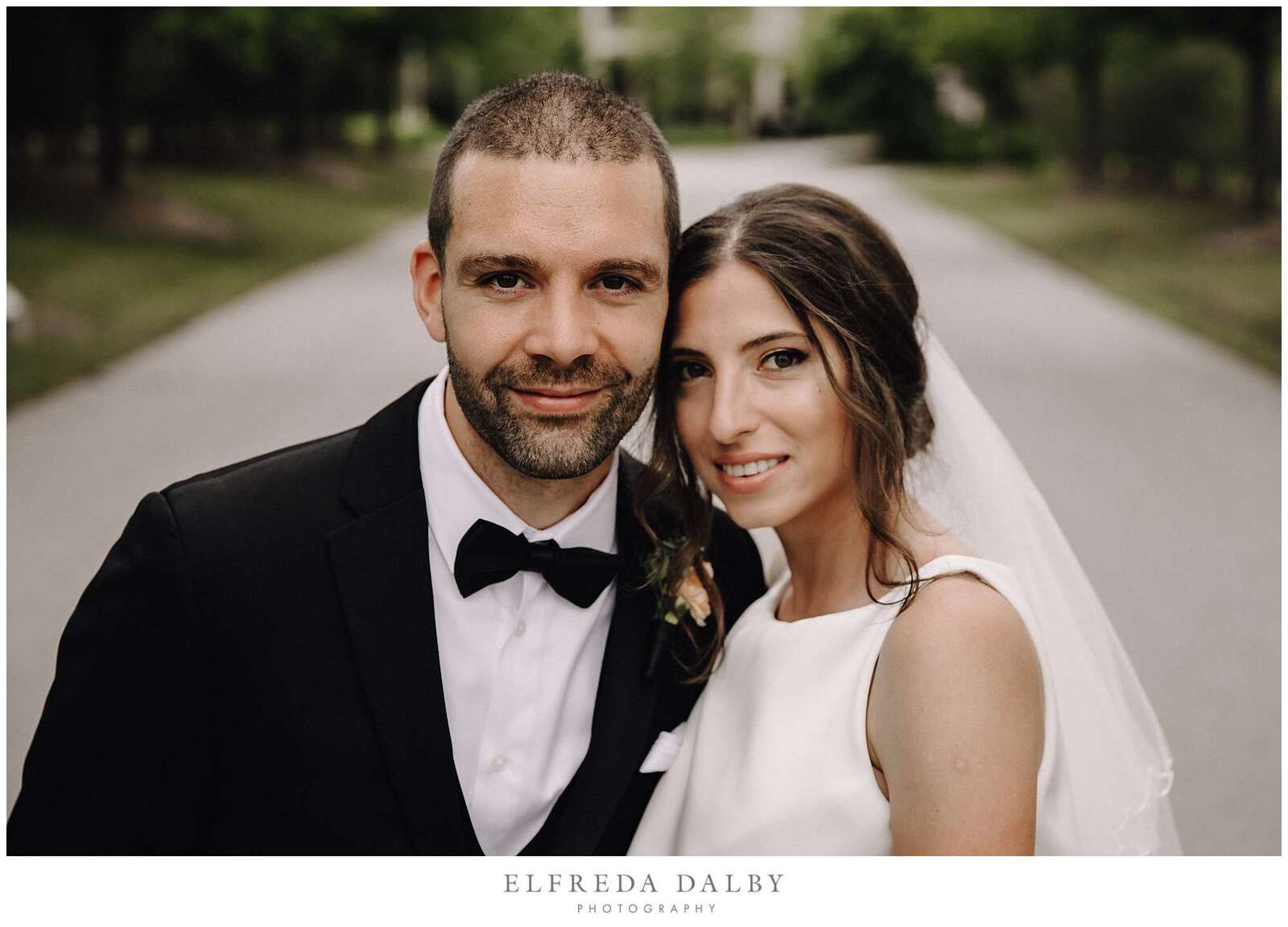 Beautiful wedding couple stand in front of Hockley Valley Resort in Mono