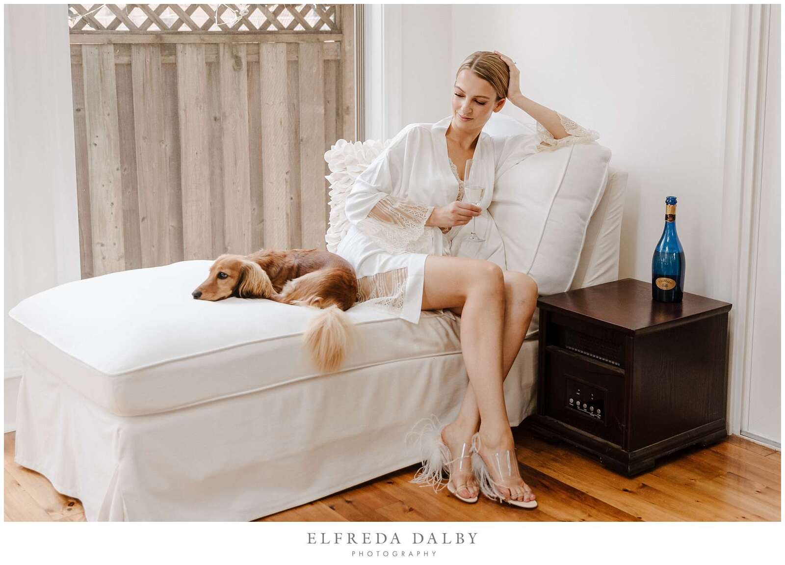 Bride sitting with her cute dog