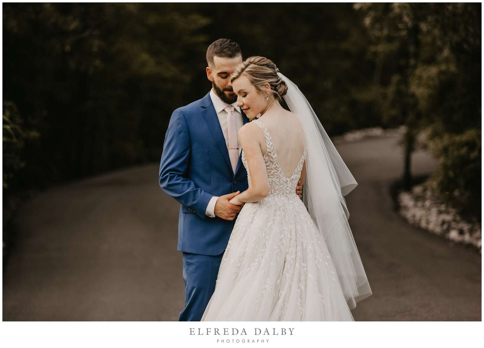 Bride and groom standing in the path at Whistle Bear Golf Club