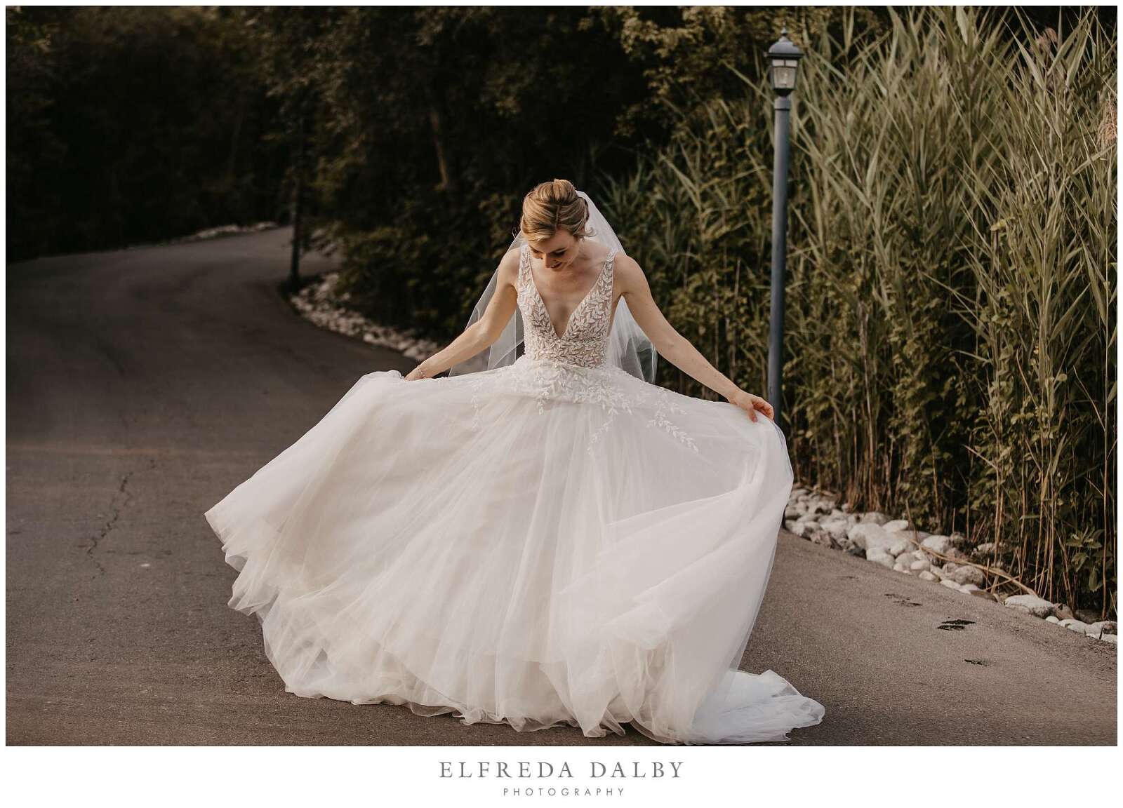 Bride playing with her wedding dress at Whistle Bear Golf Club
