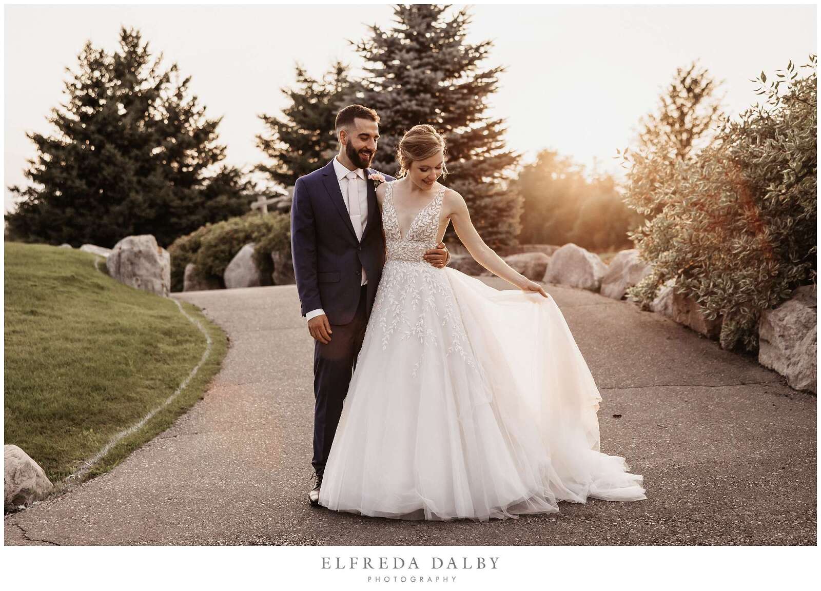 Bride and groom in the path at Whistle Bear Golf Club during sunset