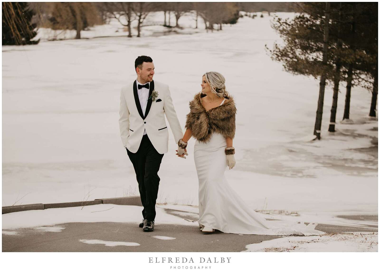 Bride and groom walking in a path at MontHill Golf & Country Club