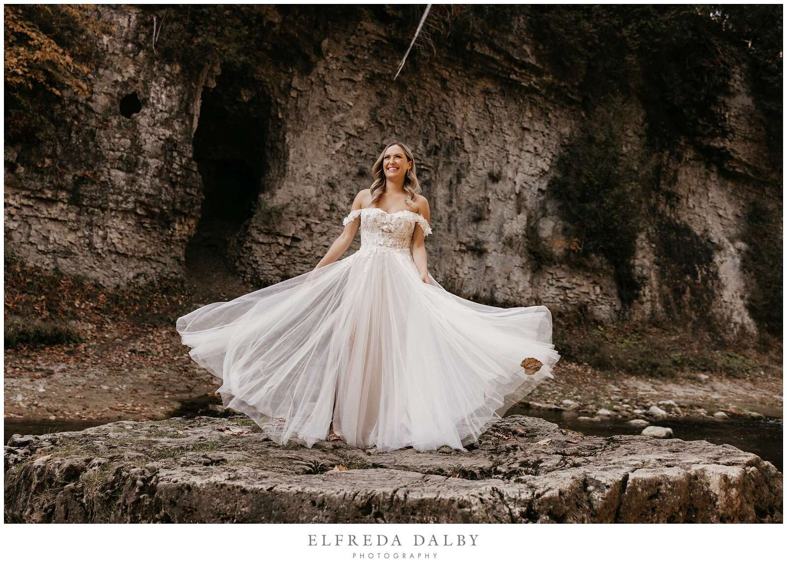 Bride standing on a rock in the Elora Gorge