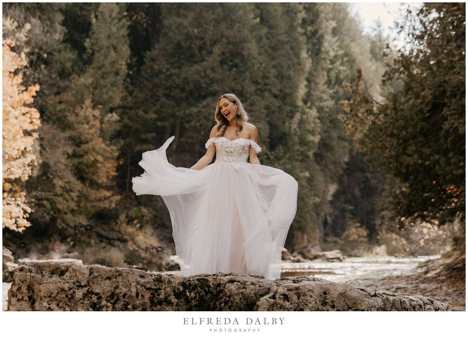 Bride standing on a rock in the Elora Gorge