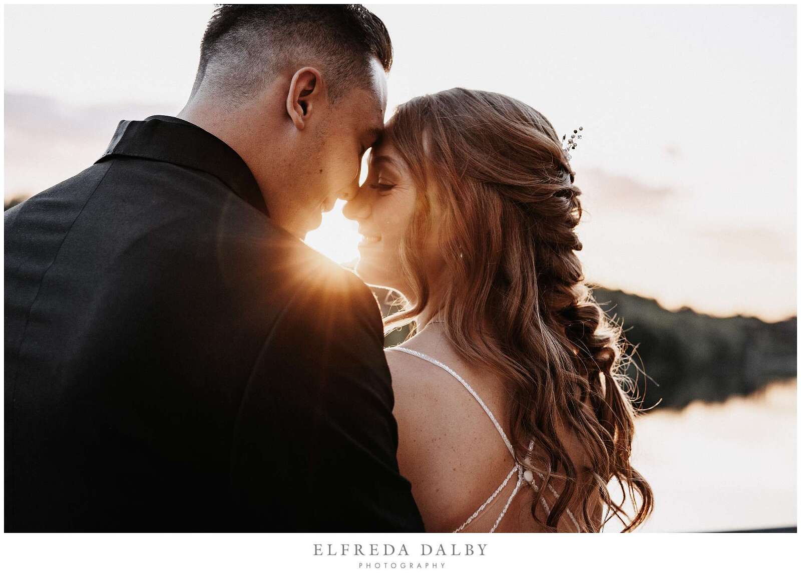 Golden light coming through bridge and groom at Cambridge Mill